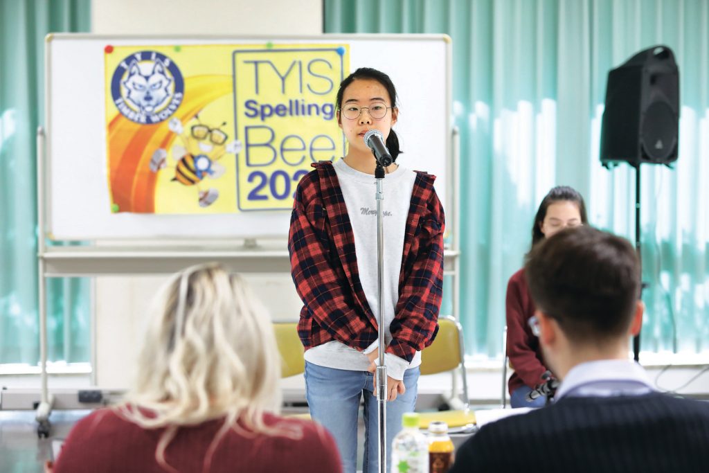 Gyuwon Shin spells a word during the bee at Tokyo YMCA International School. | TOKYO YMCA INTERNATIONAL SCHOOL
